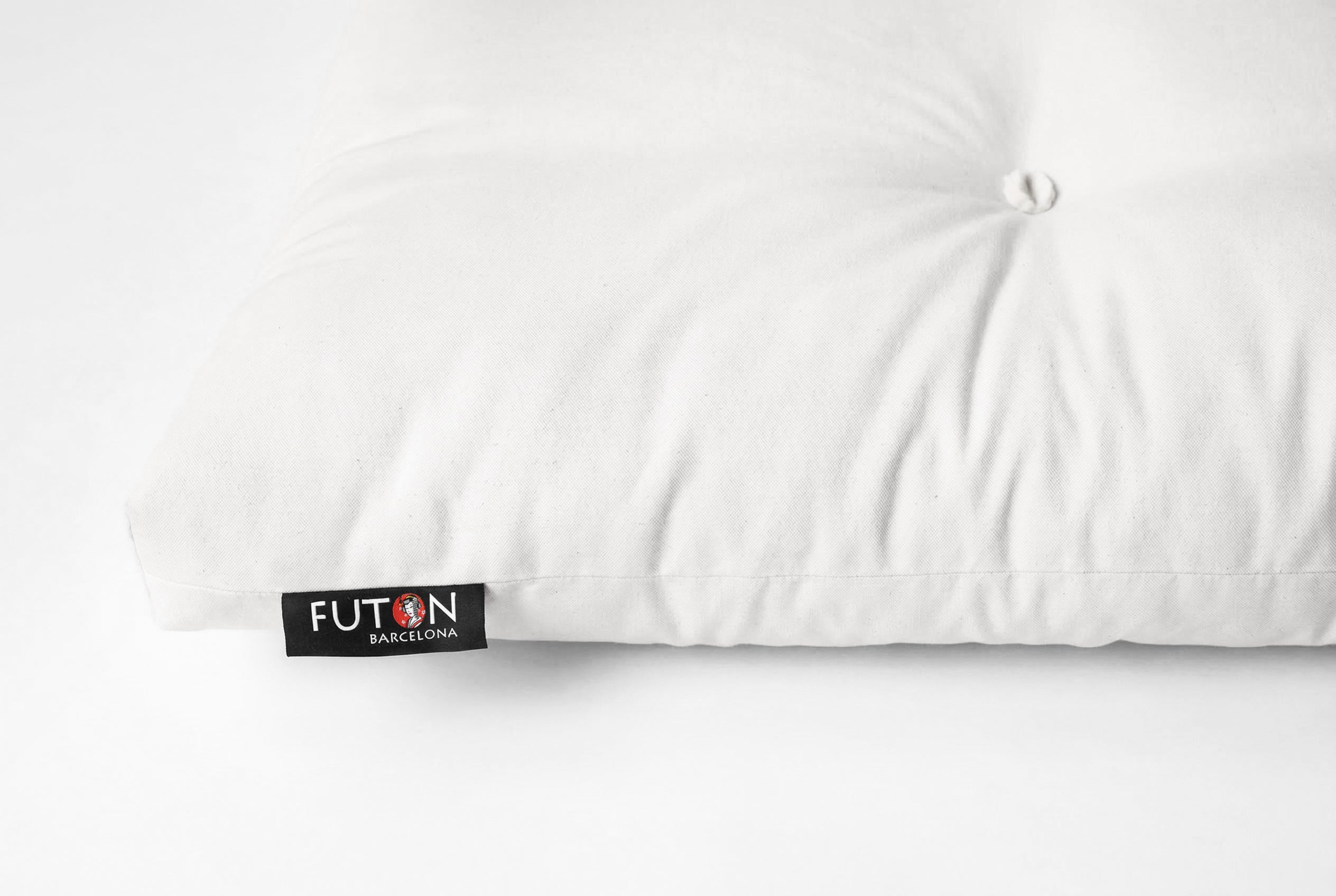 Futón japonés, colchón tradicional elaborado artesanalmente en Barcelona, ecológico y natural, con lazos para atar, primer plano